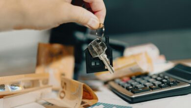 Landlord handing apartment keys to tenant over lease agreement